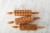 Set of three mini rolling pins for cookies with different designs