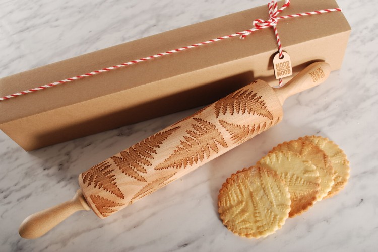 gingerbread cookies with fern leaves as holiday gift