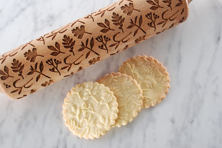 engraved wooden rolling pin with herbs motif