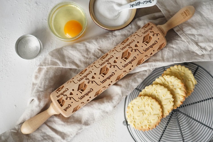 Wooden rolling pin for graduation