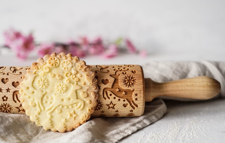 christmas cookie rolling pin with reindeer pattern