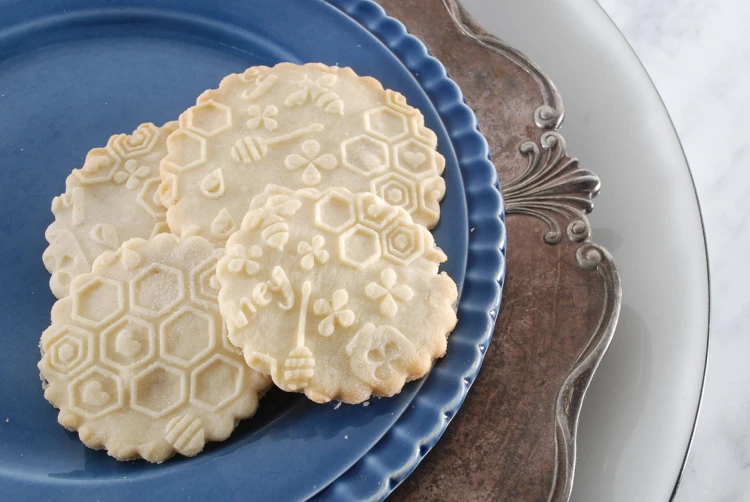 Honey cookies embossed with bees and honeycomb