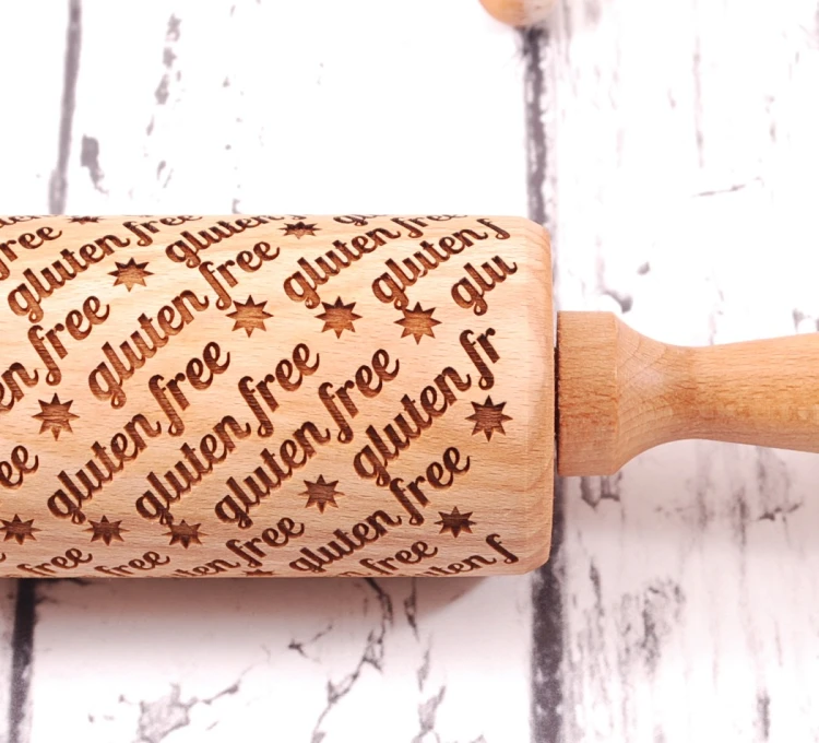 Engraved wood rolling pin gluten free motif on cookies